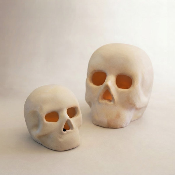 SET OF TWO CEMENT HALLOWEEN SKULLS